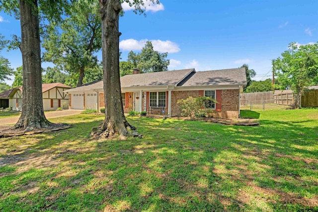 812 Jeffery Dr, Tyler, TX 75703 - view of front of property featuring brick siding, an attached garage, a chimney, and driveway