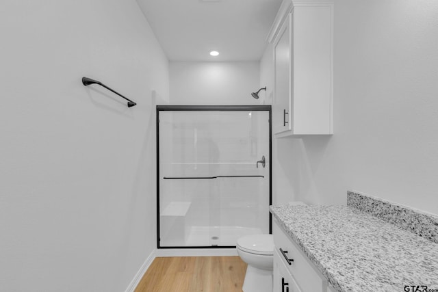 1410 W Connally St, Tyler, TX 75701 - full bath featuring a shower stall, wood finished floors, vanity, and recessed lighting