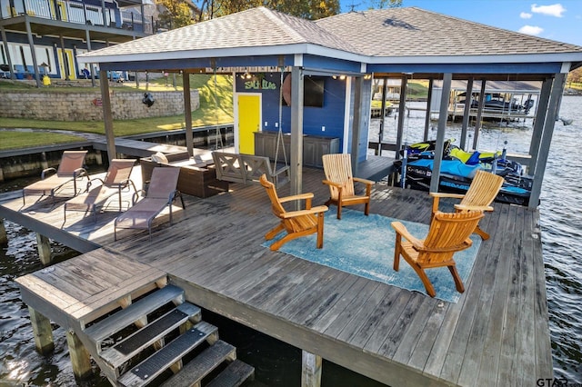 dock area with a water view and boat lift