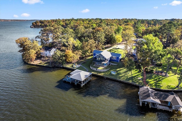 aerial view featuring a water view and a wooded view