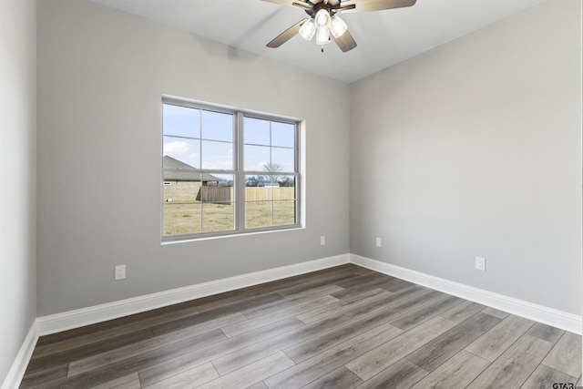 spare room with ceiling fan and hardwood / wood-style floors