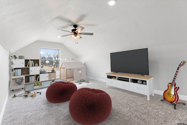 interior space featuring vaulted ceiling, ceiling fan, and carpet