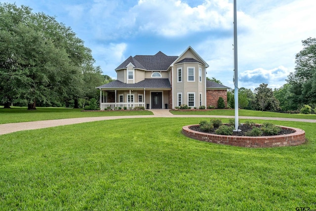 1881 Valley Vw, Tyler, TX 75701 - view of front of property with curved driveway, covered porch, and a front yard