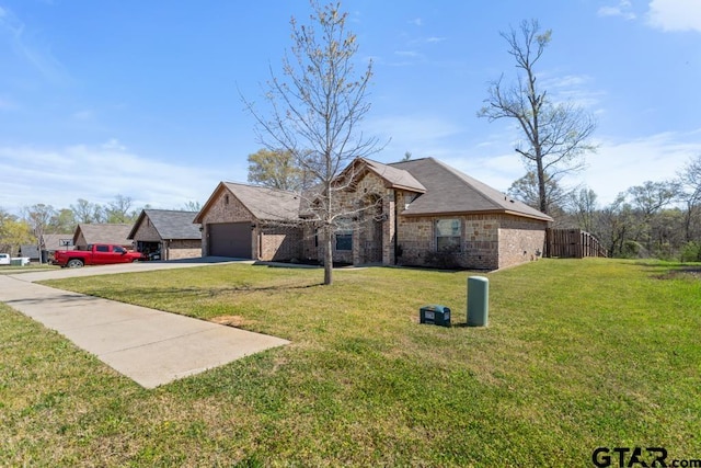 706 Duke Pl, Tyler, TX 75704 - view of front of house with brick siding, driveway, a front lawn, and a garage