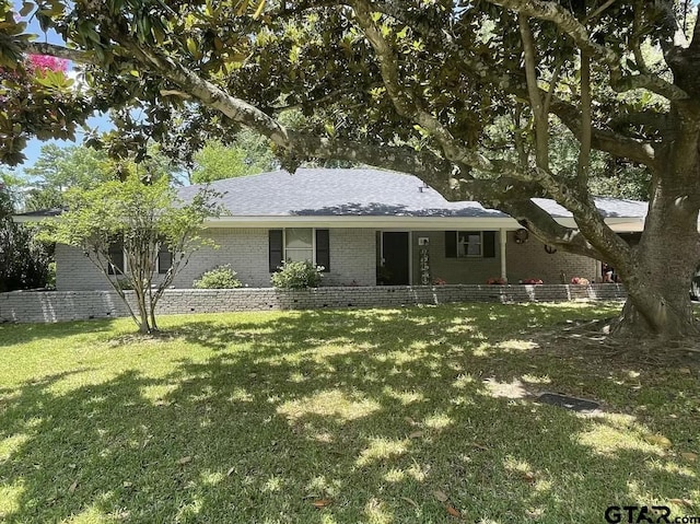 ranch-style house with a front lawn