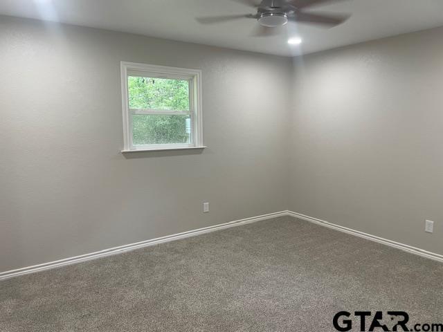 110 Alpine Dr, Tyler, TX 75701 - spare room featuring ceiling fan and carpet flooring