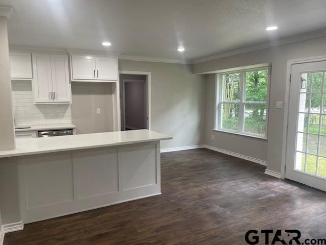 110 Alpine Dr, Tyler, TX 75701 - kitchen with white cabinets, tasteful backsplash, light countertops, ornamental molding, and stainless steel dishwasher