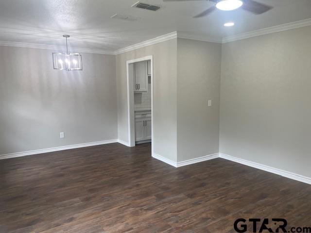 110 Alpine Dr, Tyler, TX 75701 - unfurnished room featuring dark wood-style flooring, ceiling fan, ornamental molding, and a chandelier