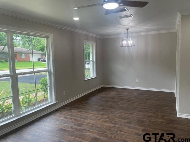 110 Alpine Dr, Tyler, TX 75701 - empty room with plenty of natural light, ceiling fan, dark wood-type flooring, a chandelier, and ornamental molding