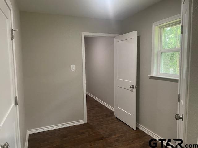 110 Alpine Dr, Tyler, TX 75701 - hallway featuring dark wood-type flooring and baseboards