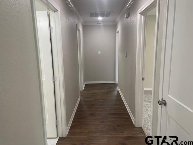 110 Alpine Dr, Tyler, TX 75701 - hall with dark wood-type flooring and crown molding