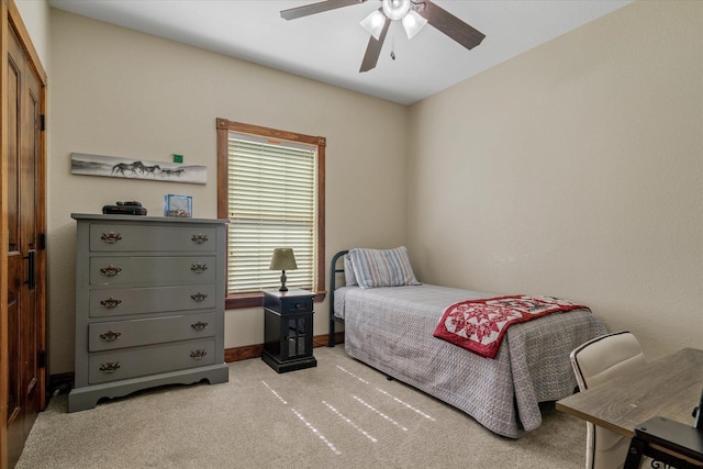 bedroom featuring ceiling fan and light carpet