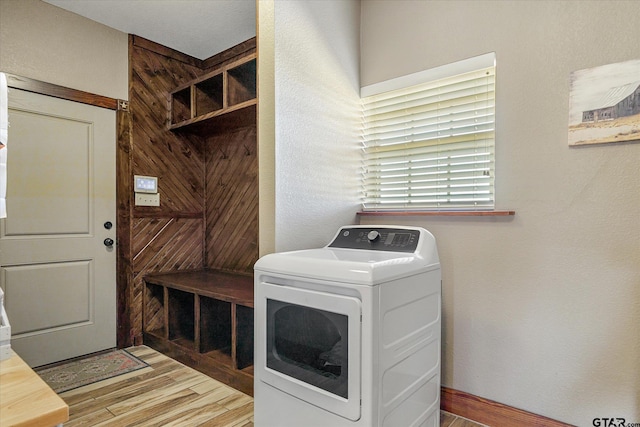 washroom with washer / clothes dryer and light hardwood / wood-style flooring