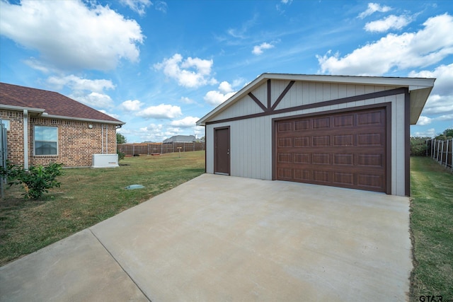 garage with a lawn