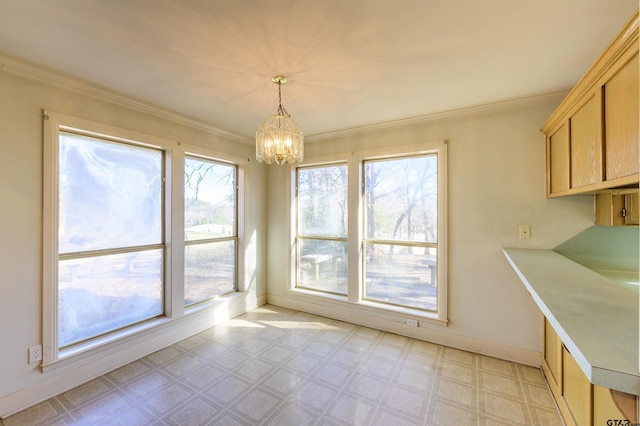 unfurnished dining area with a notable chandelier and crown molding