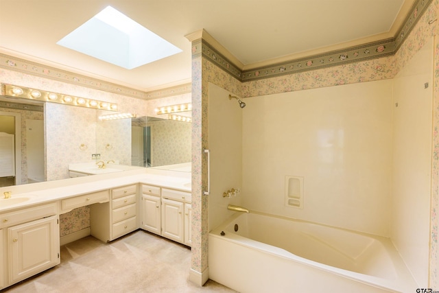 bathroom with vanity, a skylight, and bathing tub / shower combination