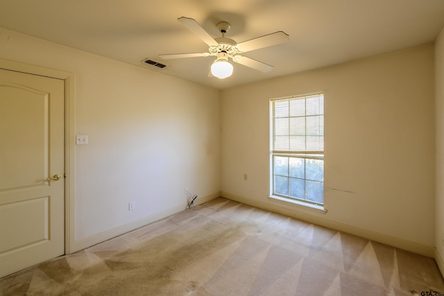 carpeted empty room with ceiling fan