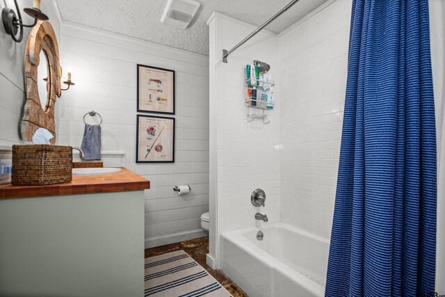 bathroom featuring vanity, visible vents, shower / tub combo, a textured ceiling, and toilet