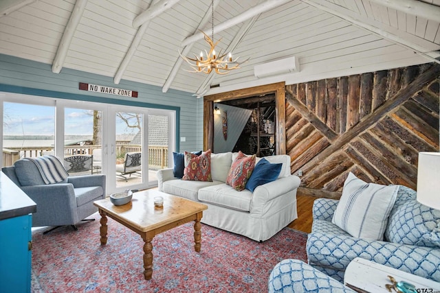 living room featuring a chandelier, wood walls, an AC wall unit, beam ceiling, and wood finished floors