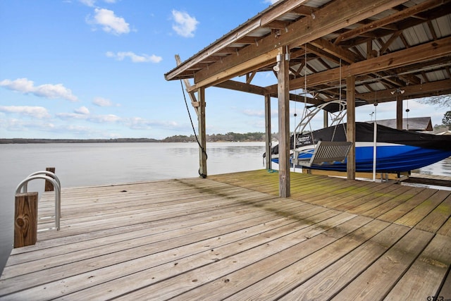 view of dock featuring a water view and boat lift