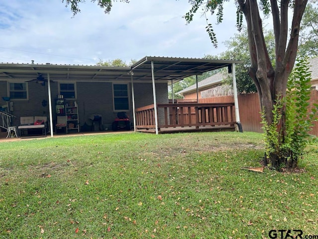 view of yard with a wooden deck