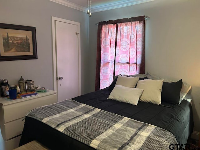 bedroom with crown molding