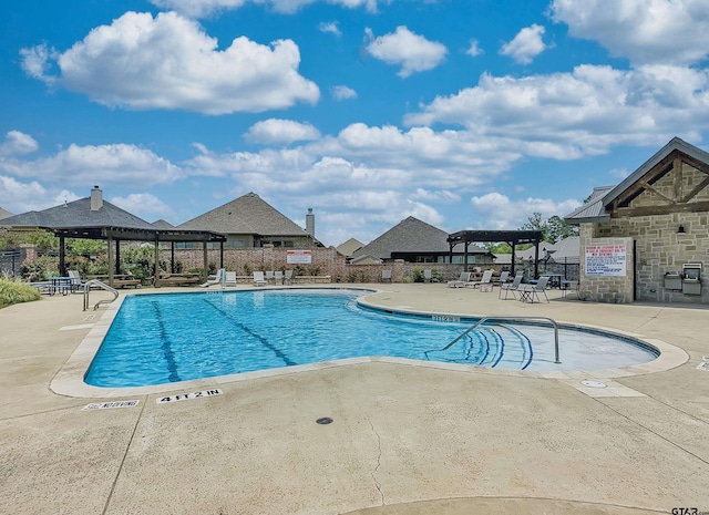 9035 Shallow Cv, Tyler, TX 75703 - community pool featuring a pergola and a patio area