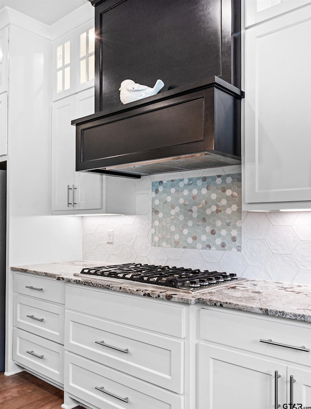 9035 Shallow Cv, Tyler, TX 75703 - kitchen featuring backsplash, white cabinets, light stone countertops, and stainless steel gas cooktop