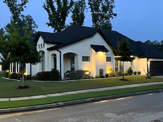 9035 Shallow Cv, Tyler, TX 75703 - view of front of home featuring brick siding, a front yard, and an attached garage