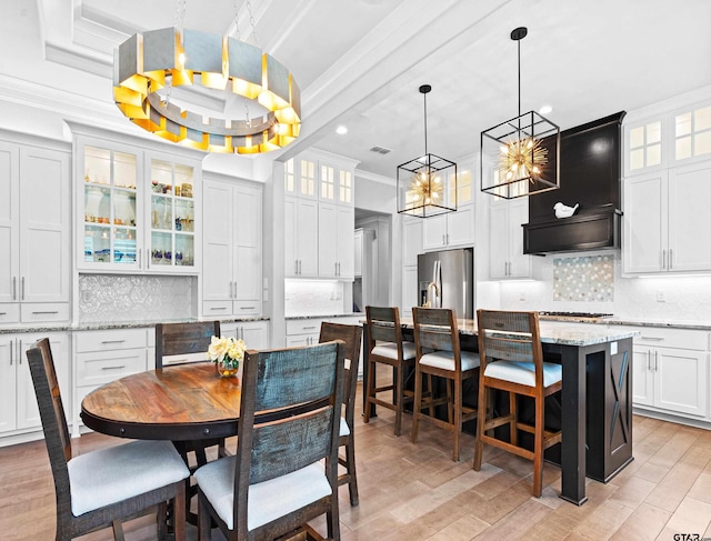 9035 Shallow Cv, Tyler, TX 75703 - dining area featuring a chandelier, crown molding, recessed lighting, and light wood finished floors