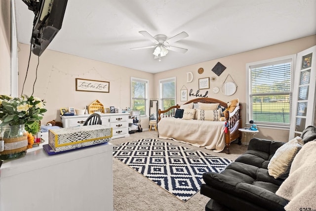 carpeted bedroom with ceiling fan