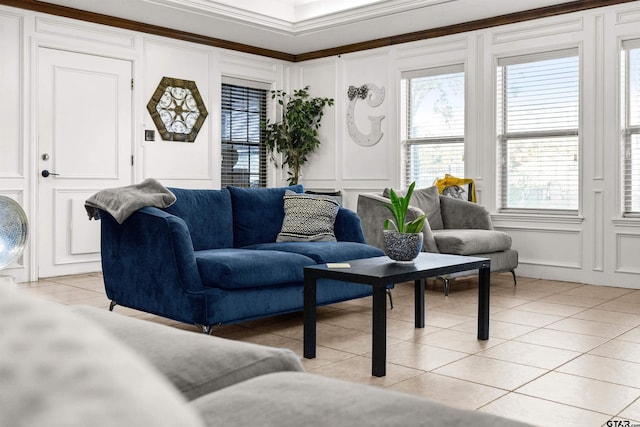 living room with light tile patterned floors, plenty of natural light, and crown molding