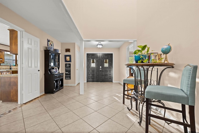 entrance foyer featuring light tile patterned floors