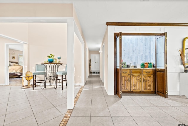 corridor with light tile patterned floors