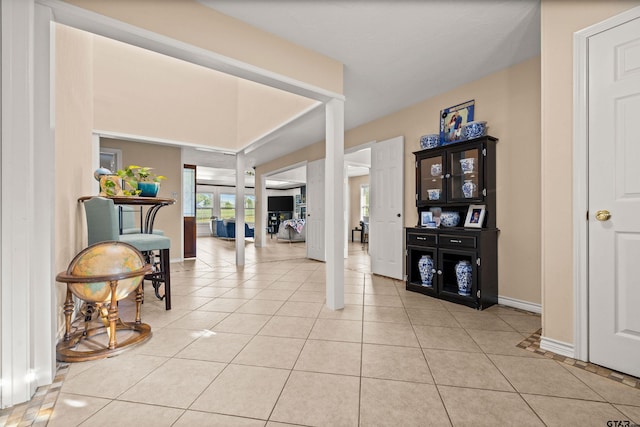 foyer entrance with light tile patterned floors