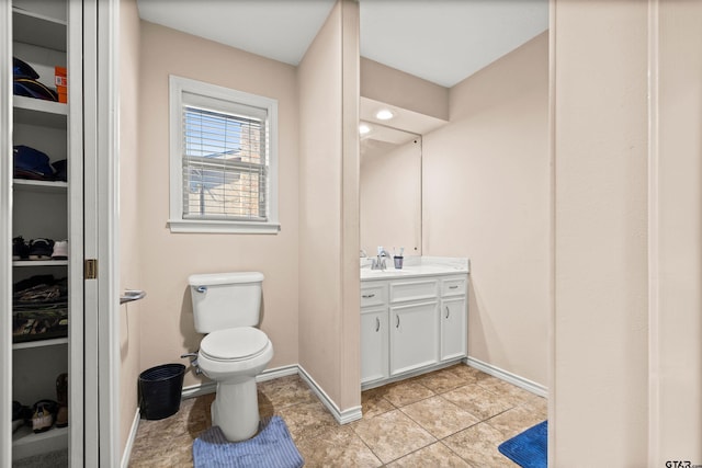 bathroom with tile patterned floors, vanity, and toilet