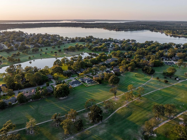 aerial view at dusk with a water view