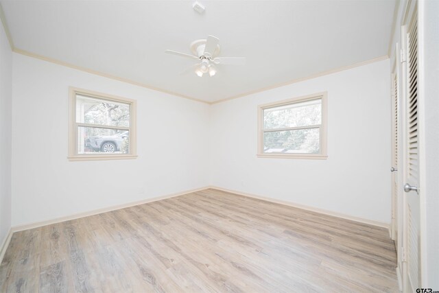 2504 Pounds Ave, Tyler, TX 75701 - unfurnished bedroom with wood finished floors, ornamental molding, baseboards, a closet, and ceiling fan
