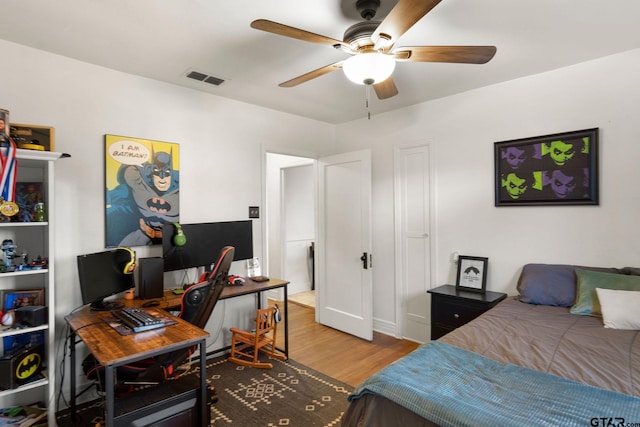 bedroom featuring ceiling fan and hardwood / wood-style floors