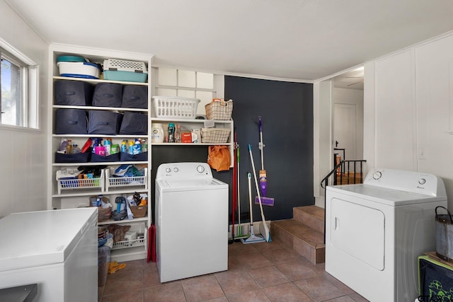 washroom featuring tile patterned flooring and separate washer and dryer