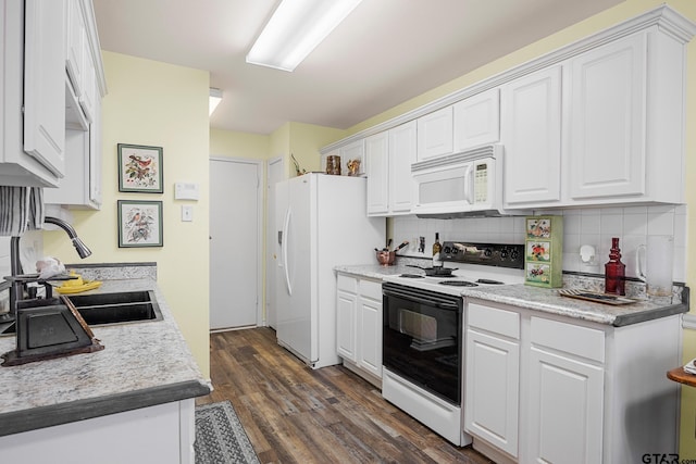 5401 Hollytree Dr, Tyler, TX 75703 - kitchen featuring white appliances, decorative backsplash, dark wood-style floors, white cabinets, and light countertops