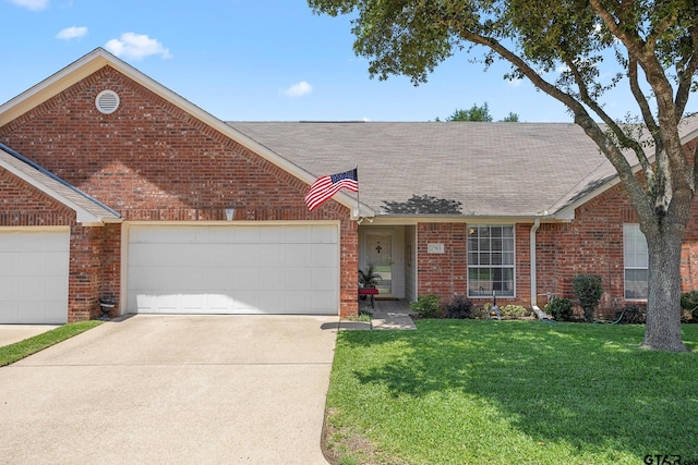 5401 Hollytree Dr, Tyler, TX 75703 - view of front of house with brick siding, roof with shingles, concrete driveway, a front yard, and an attached garage