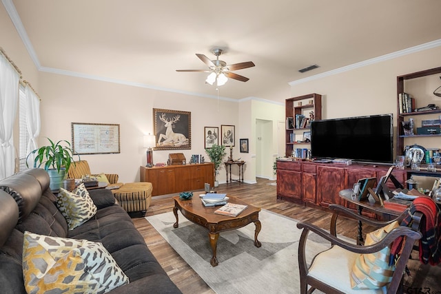 5401 Hollytree Dr, Tyler, TX 75703 - living room with wood finished floors, ceiling fan, and crown molding