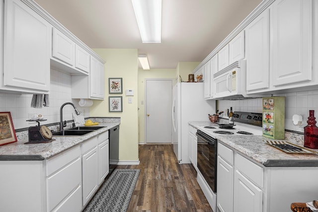 5401 Hollytree Dr, Tyler, TX 75703 - kitchen featuring electric stove, white microwave, dishwasher, white cabinetry, and decorative backsplash