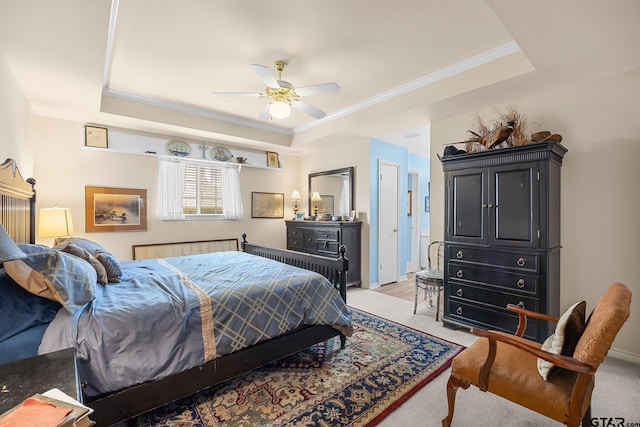5401 Hollytree Dr, Tyler, TX 75703 - bedroom featuring a tray ceiling, light carpet, crown molding, and a ceiling fan