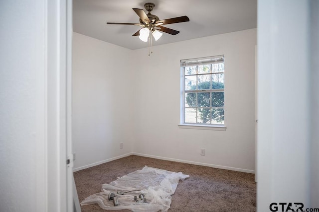 spare room with ceiling fan and carpet flooring