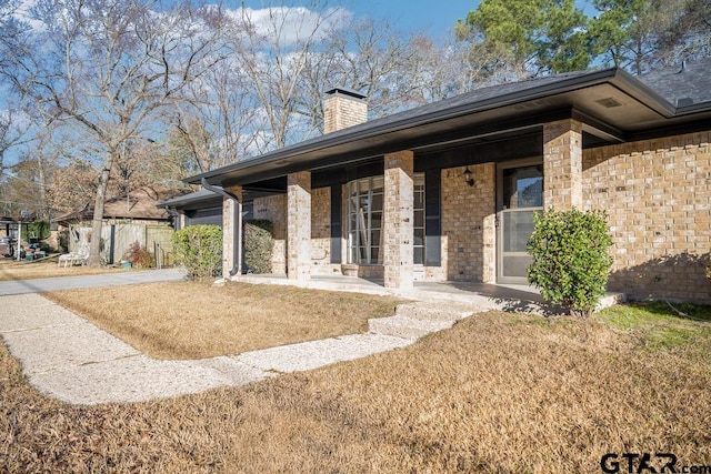 exterior space with a yard and a porch