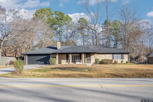 single story home with a front lawn and a garage