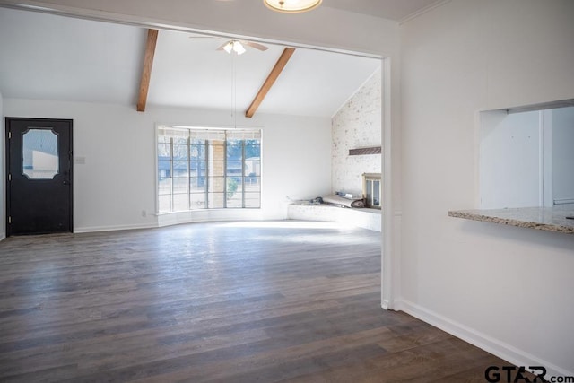 unfurnished living room with ceiling fan, dark wood-type flooring, and lofted ceiling with beams