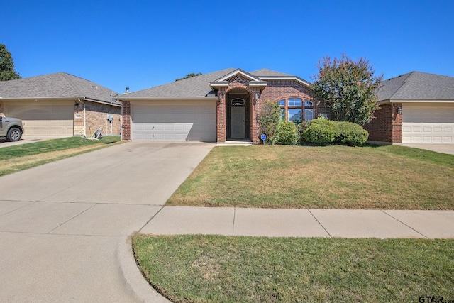 ranch-style house featuring a garage and a front lawn